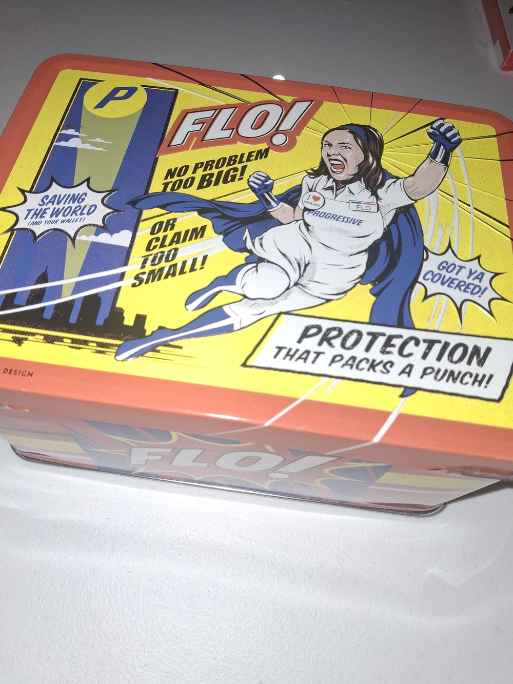 FLO! Comic-Style Tin with Bright Yellow & Coral Artwork